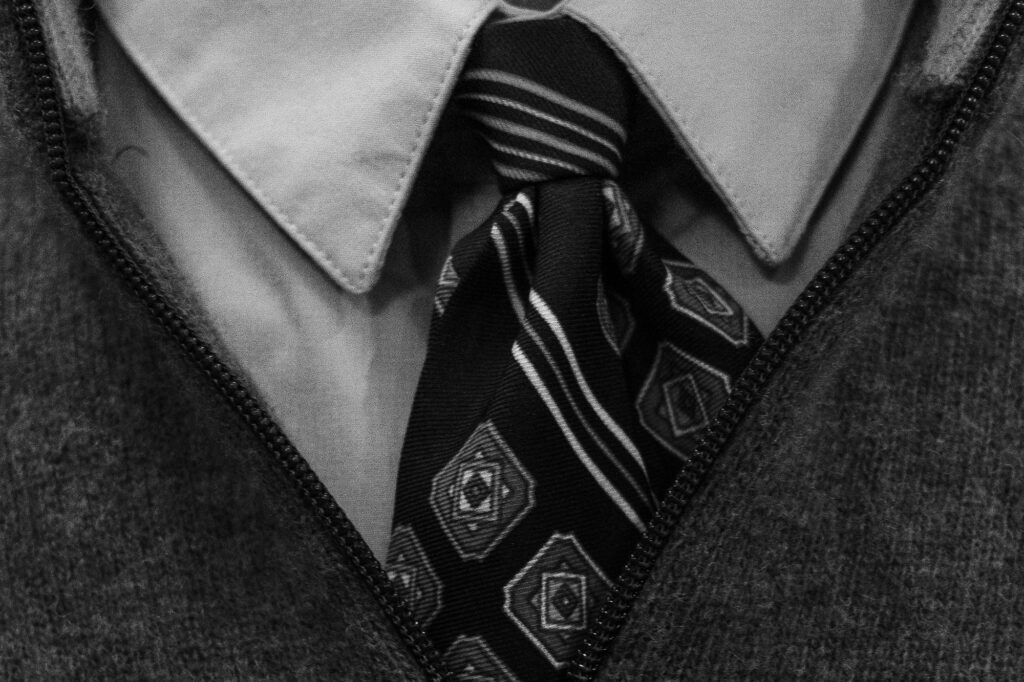 Folded school uniform shirt and tie